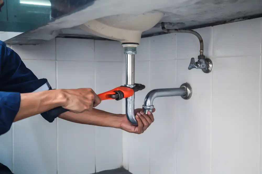 A plumber performing an inspection
